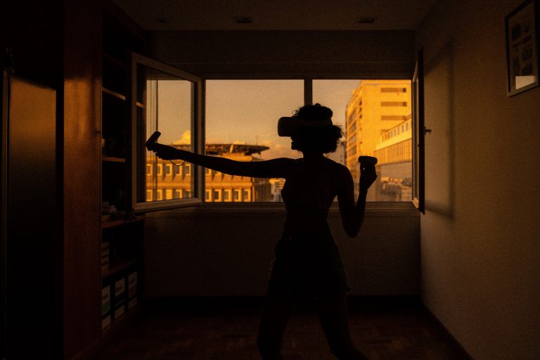 woman playing VR in her room